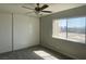 Bedroom with neutral walls, carpet, sliding door closet and a window at 745 N Royal Crest Cir # 157, Las Vegas, NV 89169