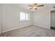 Bright bedroom features a ceiling fan and a large window with a scenic view at 745 N Royal Crest Cir # 157, Las Vegas, NV 89169