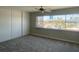 Bright bedroom with large closet and a expansive window view at 745 N Royal Crest Cir # 157, Las Vegas, NV 89169