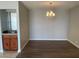 Dining area with a chandelier, wet bar, and hardwood flooring at 745 N Royal Crest Cir # 157, Las Vegas, NV 89169
