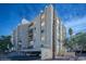 A twilight view of the condo building, highlighting its structure and landscaping with warm interior lights at 745 N Royal Crest Cir # 157, Las Vegas, NV 89169