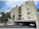 Multi-story condo complex featuring balconies and covered parking at 745 N Royal Crest Cir # 157, Las Vegas, NV 89169