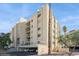 View of condo complex, boasting private balconies, covered parking, and desert landscaping against a blue sky backdrop at 745 N Royal Crest Cir # 157, Las Vegas, NV 89169