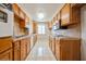 Functional kitchen with ample cabinet space, tile backsplash, and tile floors, providing a practical cooking area at 745 N Royal Crest Cir # 157, Las Vegas, NV 89169