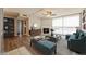 This staged living room features wood floors, a fireplace, stylish furnishings, and great city views at 745 N Royal Crest Cir # 157, Las Vegas, NV 89169