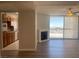 Open concept living space with a kitchen, fireplace, and large windows with views at 745 N Royal Crest Cir # 157, Las Vegas, NV 89169