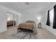 Comfortable bedroom with mirrored closet, neutral decor, and a window providing natural light at 781 Bourbon St # 1, Pahrump, NV 89048