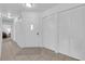 Spacious entryway with white door, tiled floor, and multiple closet spaces for ample storage at 781 Bourbon St # 1, Pahrump, NV 89048