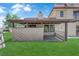 Exterior view showing the home's private patio and verdant landscaping at 781 Bourbon St # 1, Pahrump, NV 89048