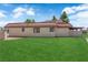 Exterior image of home with green grass and ample parking at 781 Bourbon St # 1, Pahrump, NV 89048