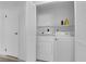 Laundry area with white washer and dryer, shelf, and louvered closet doors at 781 Bourbon St # 1, Pahrump, NV 89048