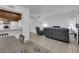 Inviting living room flows into kitchen and dining area, featuring tile floors and comfy seating at 781 Bourbon St # 1, Pahrump, NV 89048