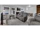 Cozy living room featuring neutral paint, plush seating, and great natural light with backyard access at 781 Bourbon St # 1, Pahrump, NV 89048