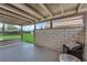Relaxing covered patio featuring open views and cool brick accents at 781 Bourbon St # 1, Pahrump, NV 89048