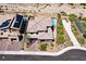 Aerial view showing a well-maintained home, lush landscaping, refreshing pool, and convenient street access at 786 Etter Creek St, Las Vegas, NV 89138