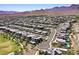 Extensive neighborhood with pools and solar panels nestled in a desert valley with a stunning mountain backdrop at 786 Etter Creek St, Las Vegas, NV 89138
