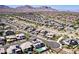 Stunning aerial view of homes in a desert community with views of the surrounding mountains at 786 Etter Creek St, Las Vegas, NV 89138