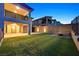 Lush backyard features a fire pit, artificial grass, and block wall at 786 Etter Creek St, Las Vegas, NV 89138