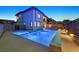 Wide view of backyard featuring a pool, spa, and lush landscaping at 786 Etter Creek St, Las Vegas, NV 89138