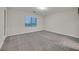 Spacious bedroom with soft carpeting and natural light from the window at 786 Etter Creek St, Las Vegas, NV 89138
