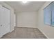Neutral bedroom featuring closet, window, and gray carpet at 786 Etter Creek St, Las Vegas, NV 89138