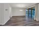 Open dining space features wood floors and sliding glass doors to the patio at 786 Etter Creek St, Las Vegas, NV 89138
