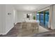 Dining room with a large table, modern lighting, and sliding glass doors to the backyard at 786 Etter Creek St, Las Vegas, NV 89138