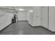 Spacious garage features speckled flooring, bright lighting, storage cabinets, and plenty of room for parking at 786 Etter Creek St, Las Vegas, NV 89138