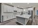 Bright, open kitchen with a large island, stainless appliances, and an adjoining pantry at 786 Etter Creek St, Las Vegas, NV 89138