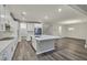 Bright, open kitchen with a large island, stainless appliances, and an adjoining pantry at 786 Etter Creek St, Las Vegas, NV 89138