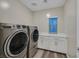 Laundry room showcases washer, dryer, and storage at 786 Etter Creek St, Las Vegas, NV 89138