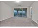 Spacious living room featuring sliding doors to balcony at 786 Etter Creek St, Las Vegas, NV 89138