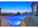 Backyard pool with water feature and lush landscaping at 786 Etter Creek St, Las Vegas, NV 89138