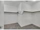 Empty walk-in closet with soft carpeting and shelf and rod organization at 786 Etter Creek St, Las Vegas, NV 89138