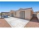 Spacious backyard area featuring a concrete patio with outdoor seating at 820 Peach Ave, North Las Vegas, NV 89032