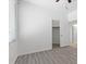 Bright bedroom features wood-look flooring and a large window letting in ample natural light at 820 Peach Ave, North Las Vegas, NV 89032