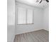 This light and airy bedroom includes a ceiling fan, window with blinds and luxury vinyl flooring at 820 Peach Ave, North Las Vegas, NV 89032