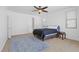 Well-lit bedroom boasts neutral walls, a ceiling fan, and modern finishes for a cozy and inviting atmosphere at 820 Peach Ave, North Las Vegas, NV 89032