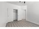 Bedroom with wood floors and closet with sliding doors at 820 Peach Ave, North Las Vegas, NV 89032