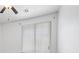 This bedroom includes a ceiling fan and window with blinds, for a simple and bright look at 820 Peach Ave, North Las Vegas, NV 89032