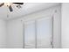 Bright bedroom features a ceiling fan and window with white blinds, offering a blank canvas for personalization at 820 Peach Ave, North Las Vegas, NV 89032