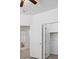 Hallway leading into bedroom with en-suite bathroom and closet with sliding doors at 820 Peach Ave, North Las Vegas, NV 89032