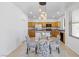 Inviting kitchen featuring wood cabinetry, stainless steel appliances, and adjacent dining area at 820 Peach Ave, North Las Vegas, NV 89032