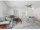 Cozy living room showcasing modern tile floors, neutral paint, and views to dining area at 820 Peach Ave, North Las Vegas, NV 89032