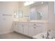 Bathroom featuring dual vanities and large mirrors at 832 Gallery Course Dr, Las Vegas, NV 89148