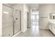 Modern bathroom featuring glass shower, tile floors and double sink vanity at 832 Gallery Course Dr, Las Vegas, NV 89148