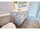 Bathroom featuring tiled floor, toilet, and vanity with chrome hardware and white countertop at 832 Gallery Course Dr, Las Vegas, NV 89148