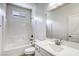 Bathroom featuring a shower-tub combo, a modern vanity, and a large mirror at 832 Gallery Course Dr, Las Vegas, NV 89148