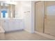 Bathroom featuring a glass shower and a dual vanity at 832 Gallery Course Dr, Las Vegas, NV 89148