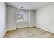 Bright bedroom with a large window and neutral carpet flooring at 832 Gallery Course Dr, Las Vegas, NV 89148